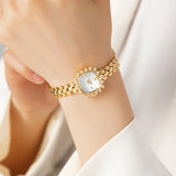 Lana® - Reloj dorado con cristales y pulsera entrelazada