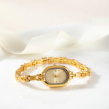 Helena® - Reloj dorado con esfera ovalada y bisel negro
